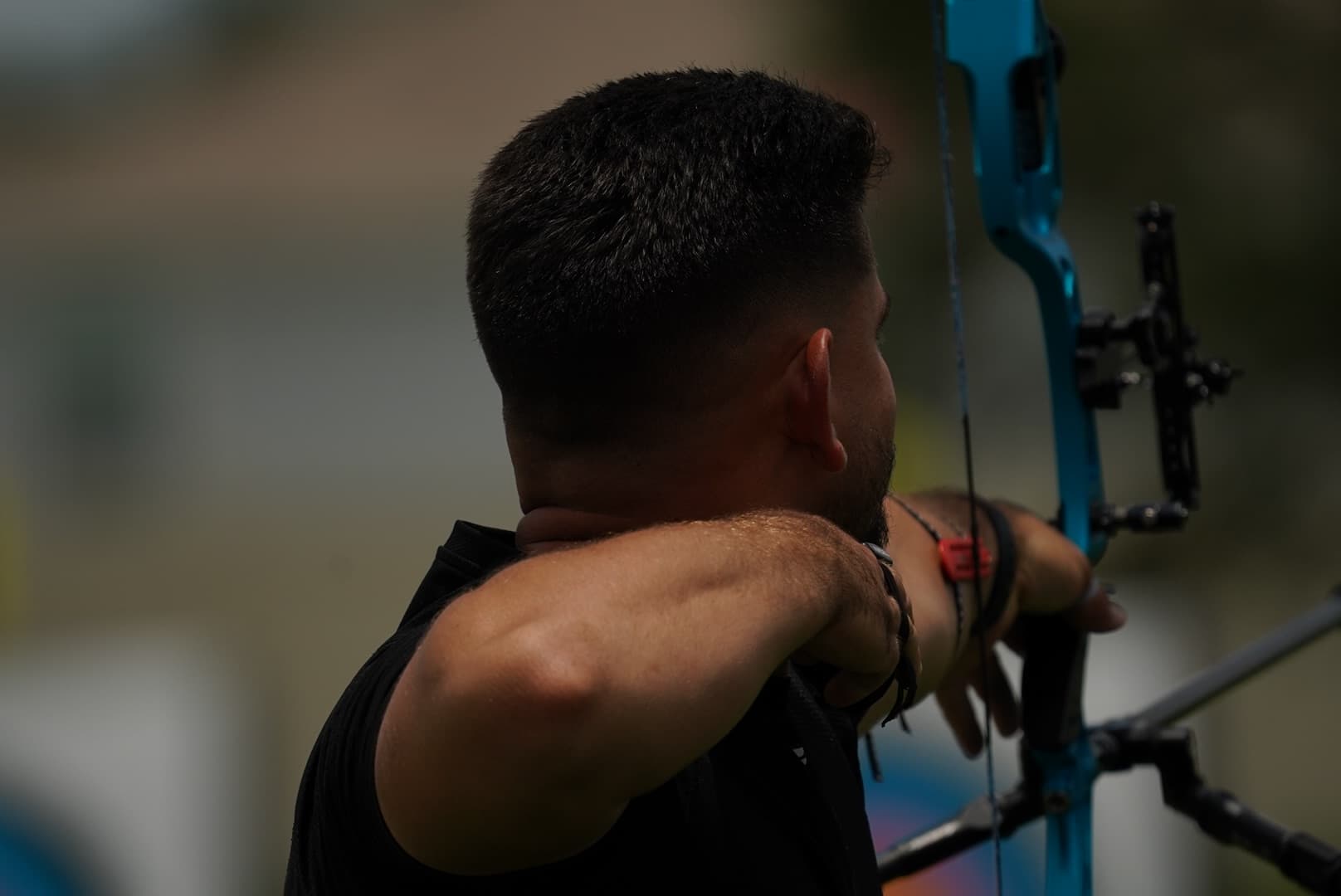 Hazael J. Rodríguez Valero focused during archery training