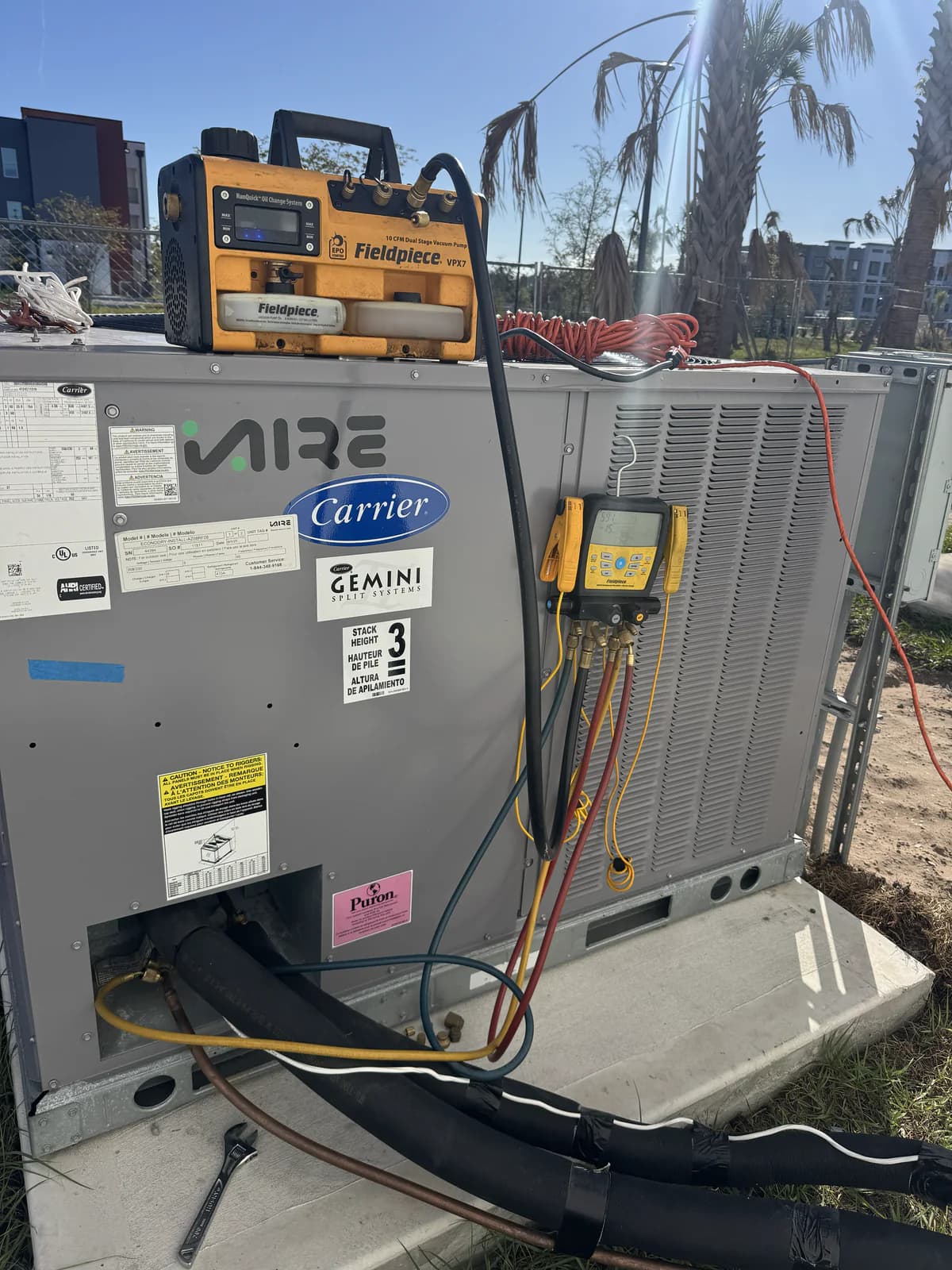 Commercial HVAC diagnostic setup with Fieldpiece recovery and manifold tools